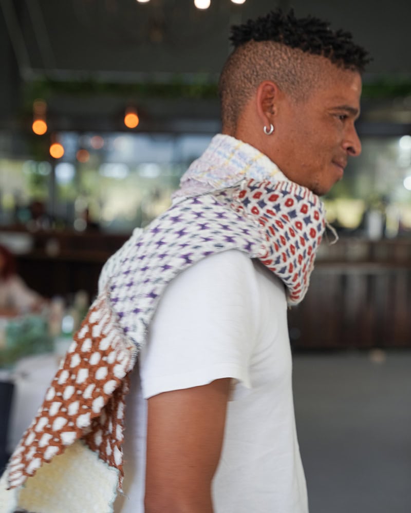 Ingrid's scarf, named, "My Time at Mungo" is an homage to the samples she wove on the handloom. Modelled by Marco