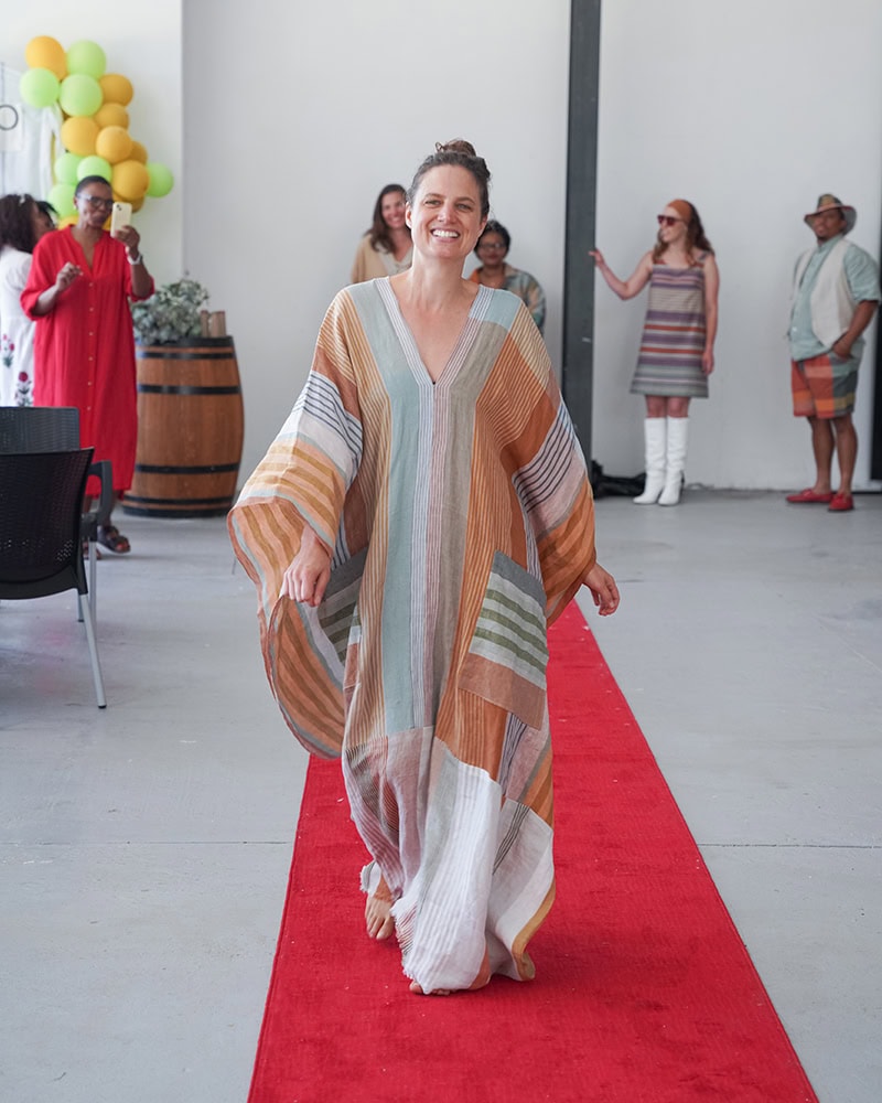 Danette, modelling her design, Orange Jewel, woven with linen scarf fabric