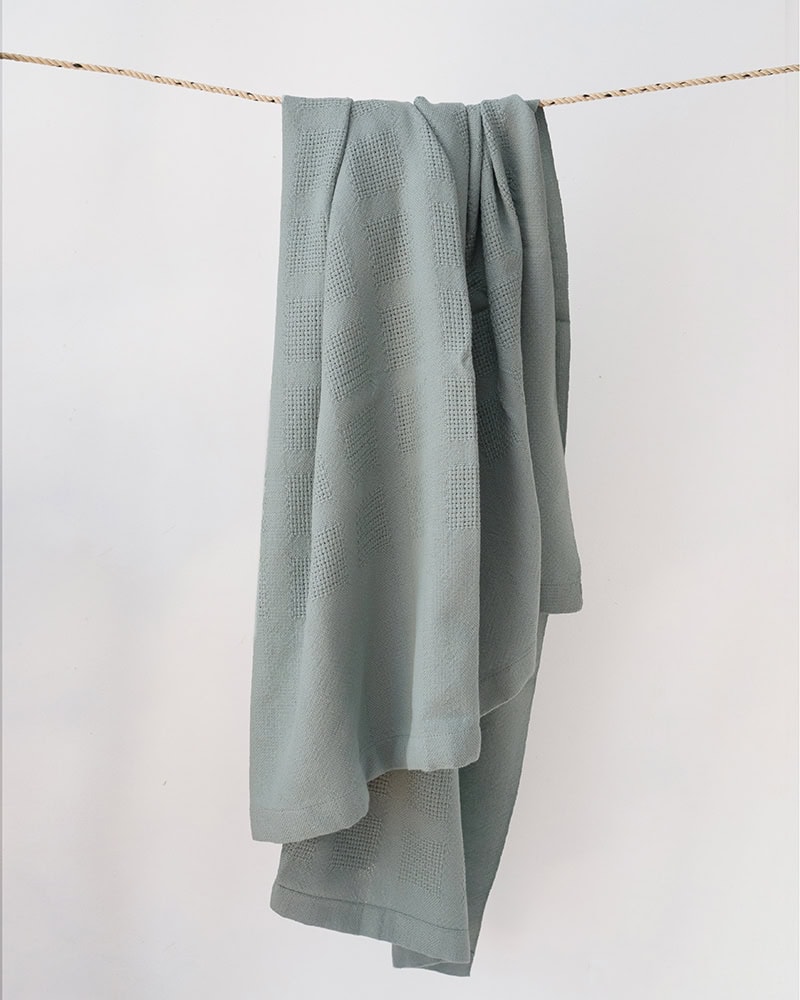 Draped Mungo Cot Baby Blanket woven from 100% Organic Cotton in Green Blue.