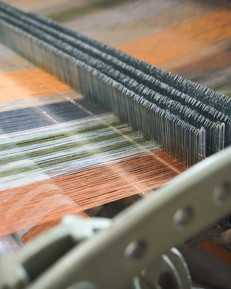 The Stria Tablecloth on the loom woven in the Mungo Mill.