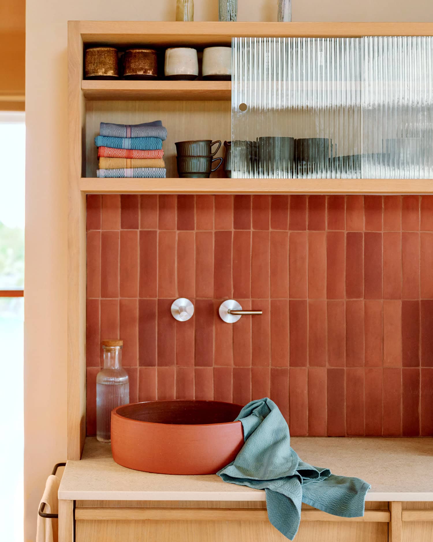 Mungo Boma cloth in Mint draped on sink in the kitchen.