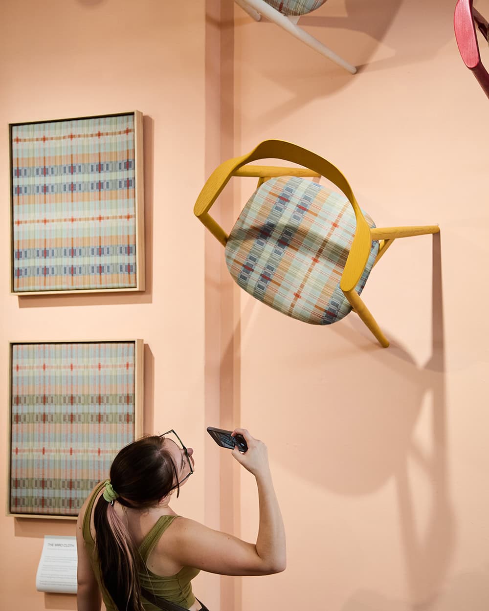 Viewer taking photos of the Mungo and James Mudge Furniture Studio installation for Cape Town Furniture Week.