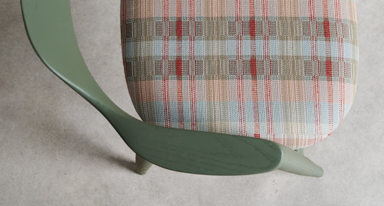 Close up of James Mudge Harrington chair with Mungo Miro cloth upholstery.