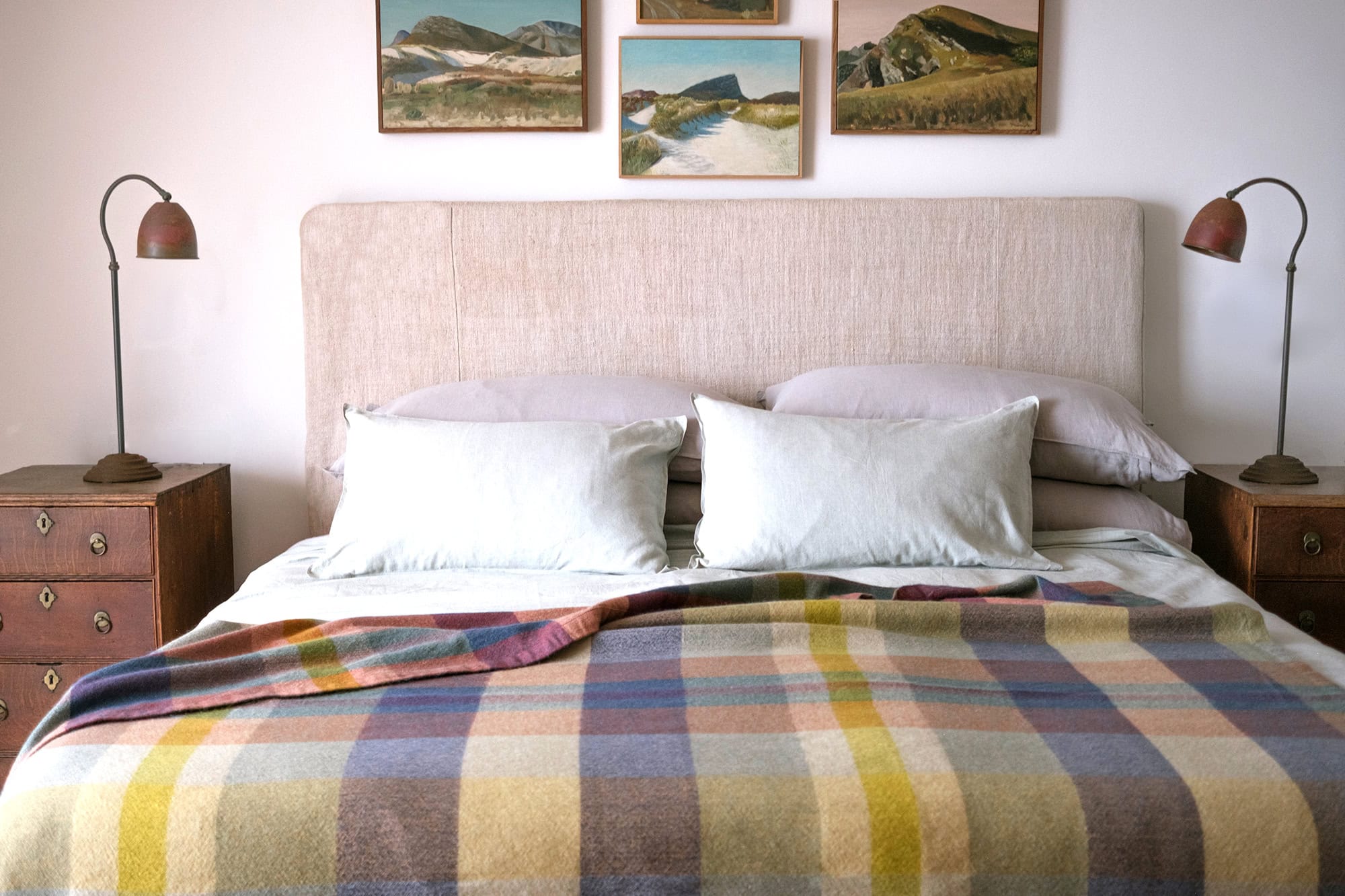 A bedroom with a Mungo Momo blanket in Twilight on the bed.
