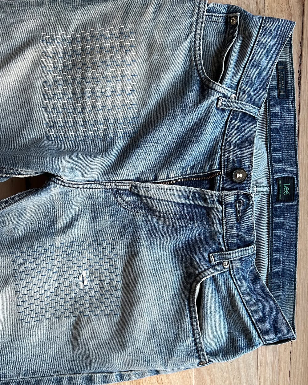 Lucie's partner's jeans. Mended with patches and shashiko stitching.