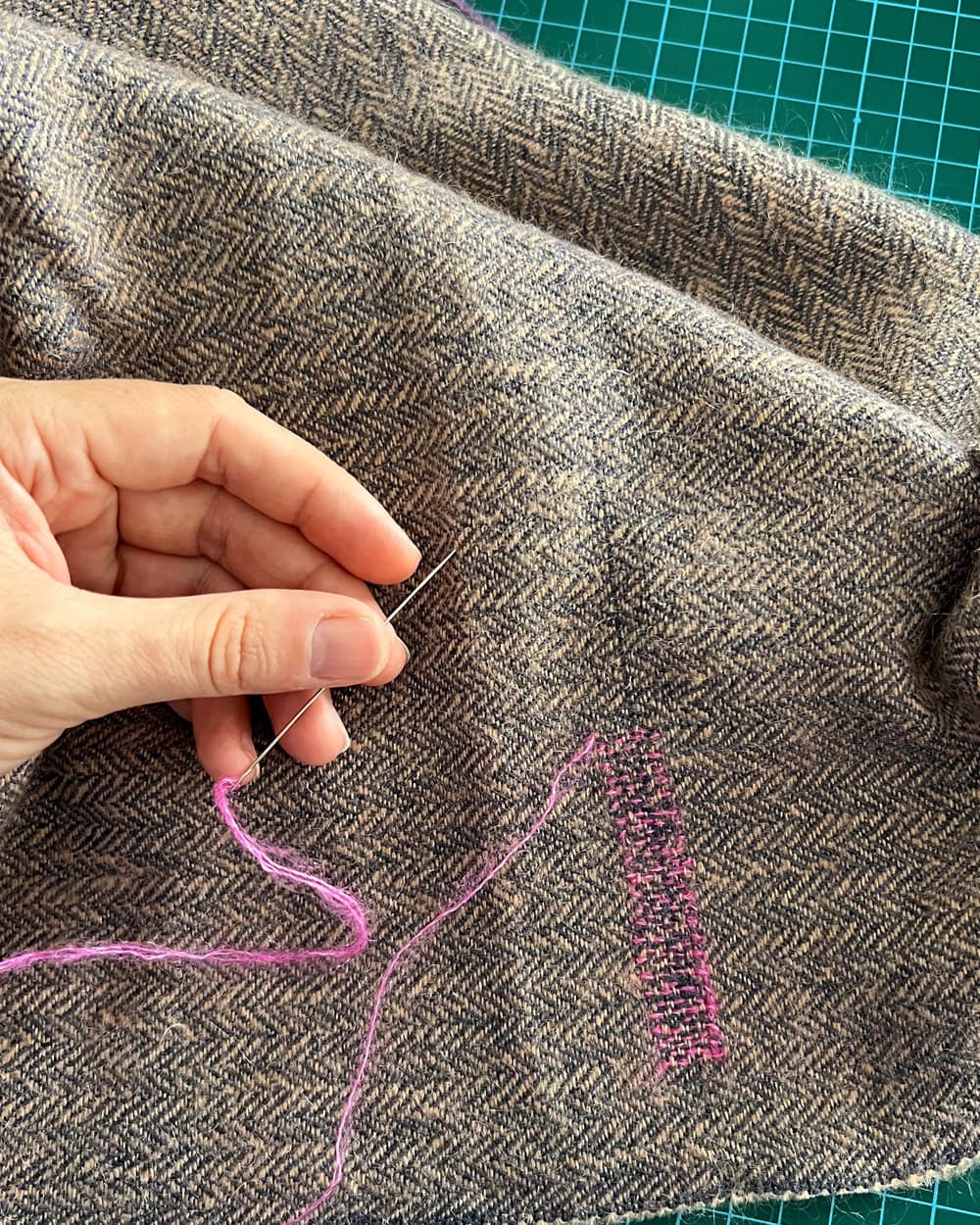 Lucie Mending the Mos Wrap for Mungo.