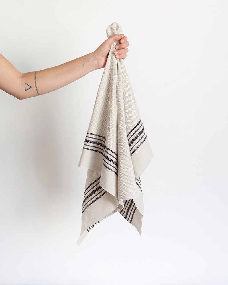 Model holds Mungo Utility Cloth.